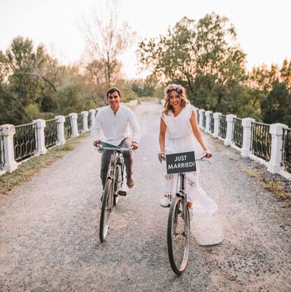 Bride and groom on bikes