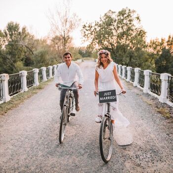 Bride and groom on bikes